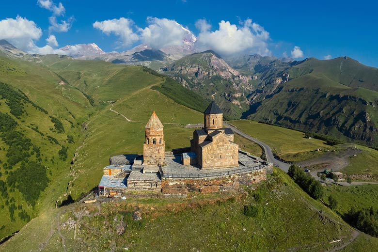 The remote Gergeti Trinity Church near Mount Kazbek The remote Gergeti Trinity Church near Mount Kazbek